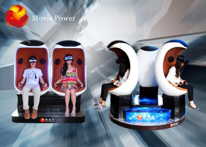 O equipamento engraçado do parque de diversões dos jogos 2 assentos dobro de realidade virtual do simulador do assento 9D VR egg o cinema 0
